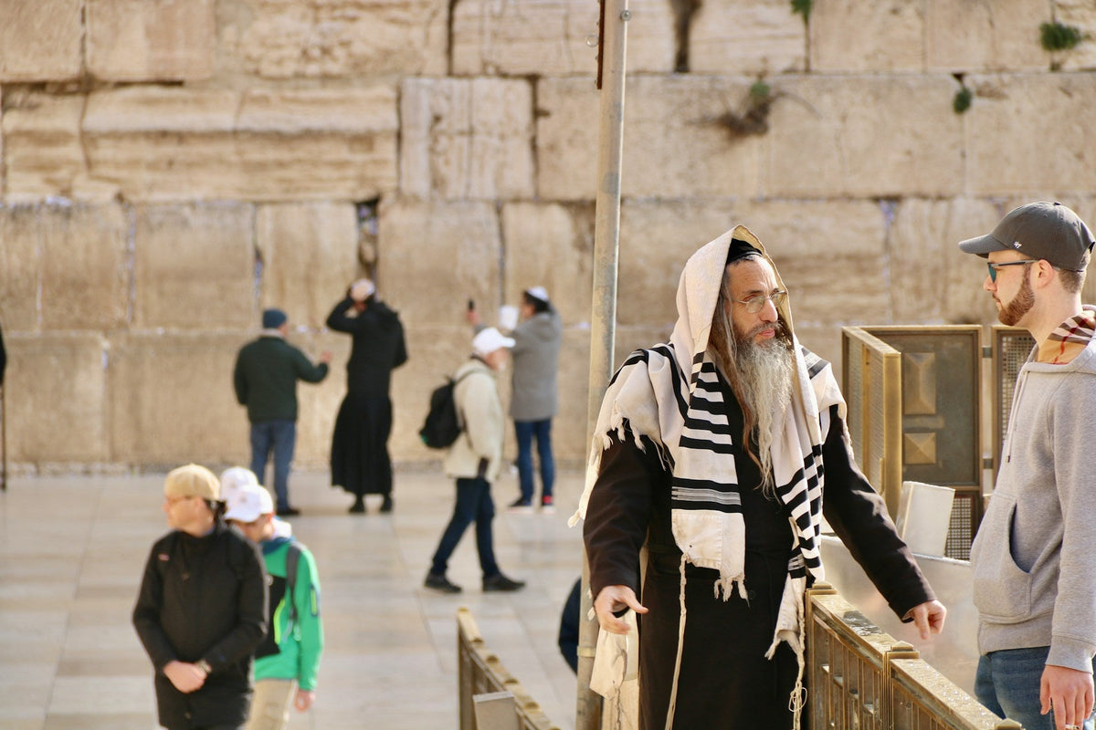 man teaching hebrew grammar to english speaker